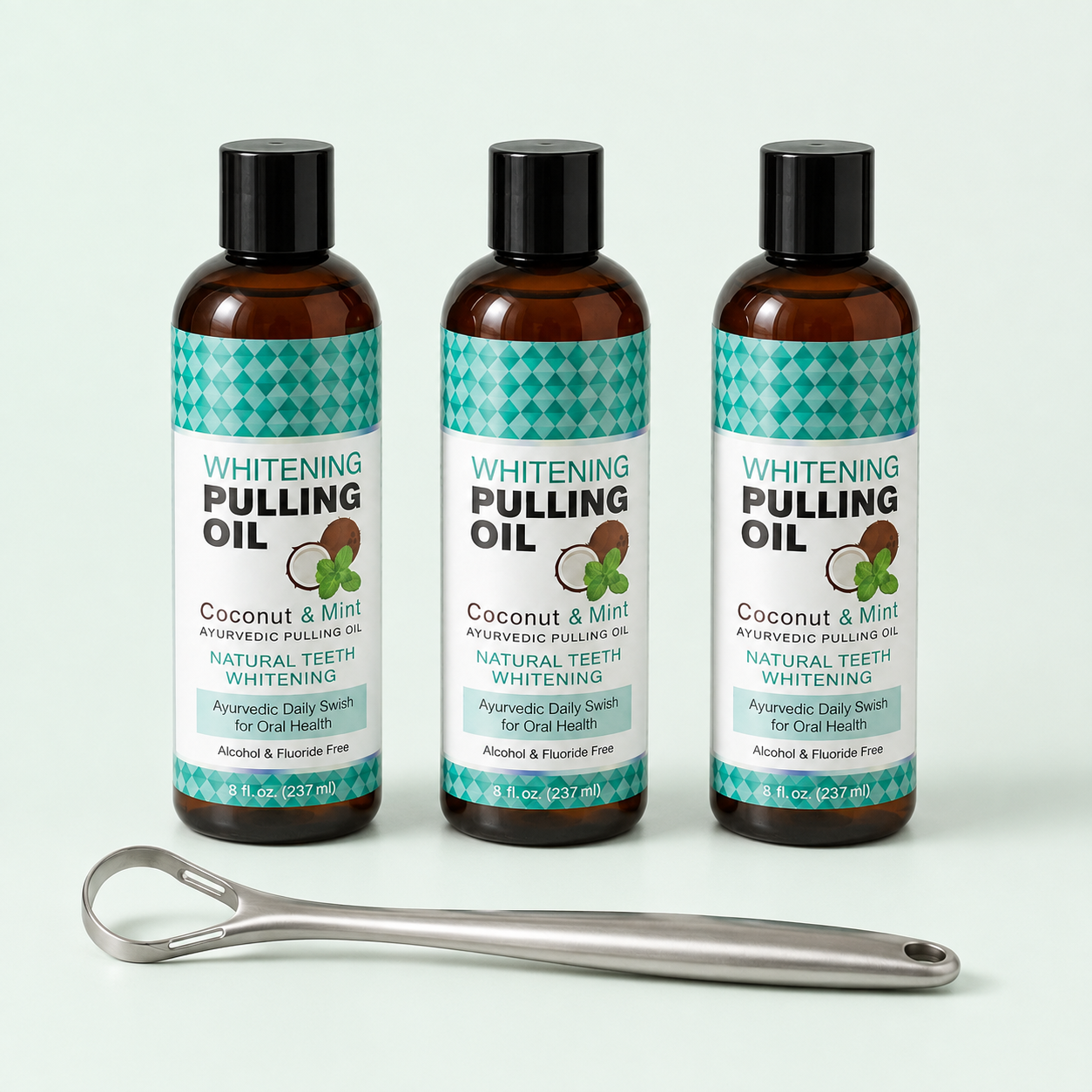 Three 8 fl oz Coconut and Mint pulling oil bottles with one free tongue scraper