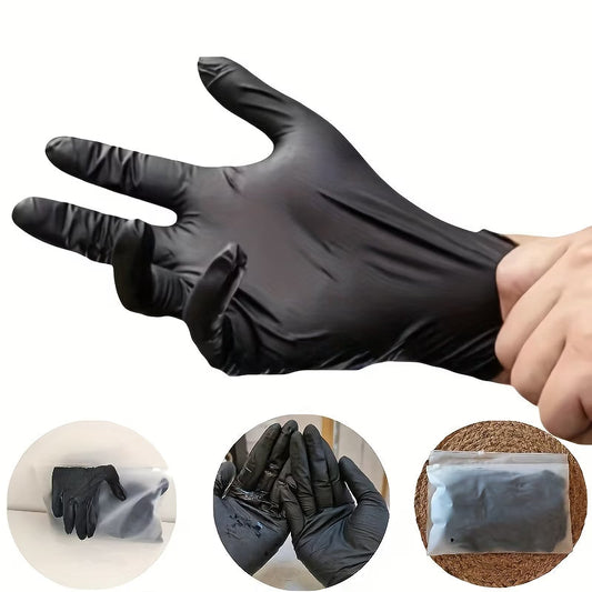 Black disposable cleaning glove shown stretched in a product demonstration