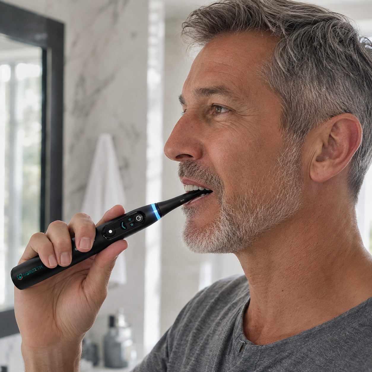 Adult using a SORQETH electric toothbrush around the back teeth