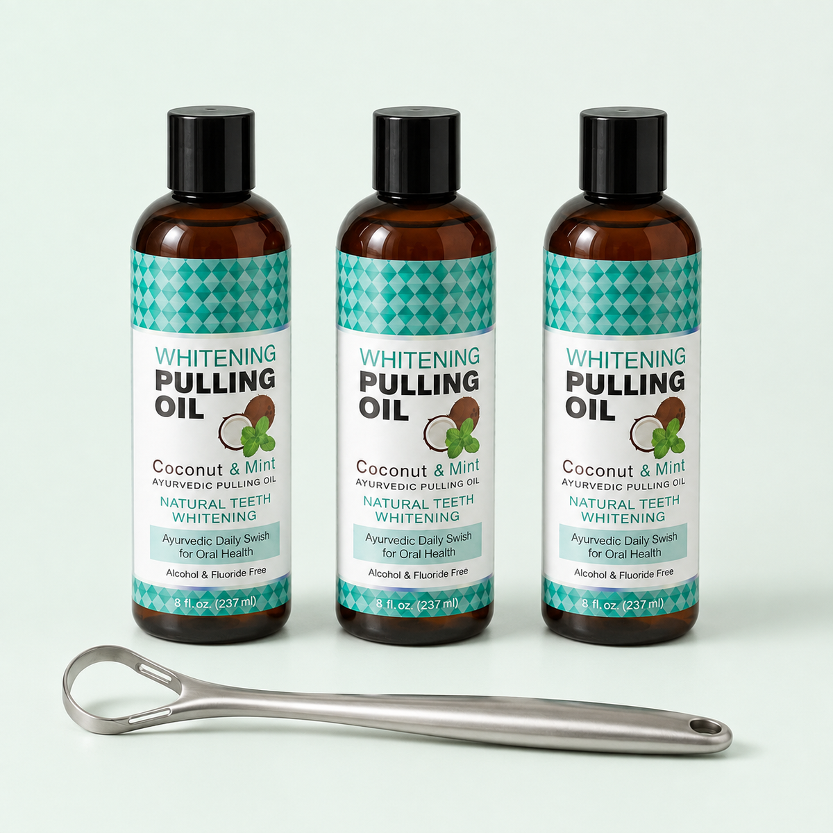Three 8 fl oz Coconut and Mint pulling oil bottles with one free tongue scraper